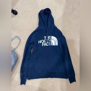 The North Face blue sweatshirt with reflective logo